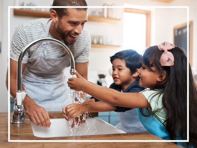 Dad and kids washing hands
