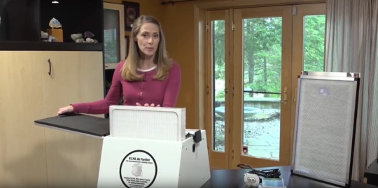 A woman with air cleaner equipment