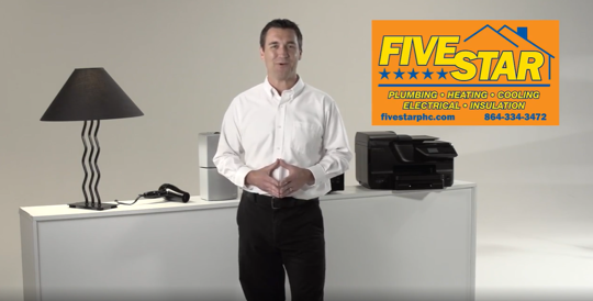 a man with electrical appliances at his back