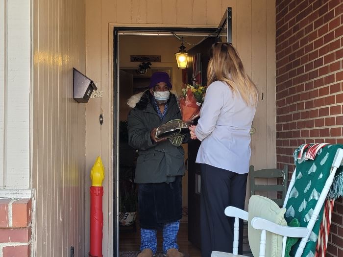 woman passing out food