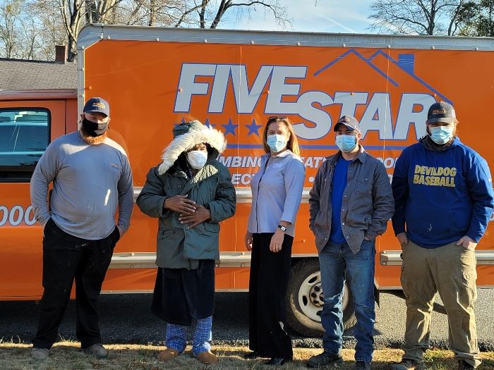 people standing in front of a truck