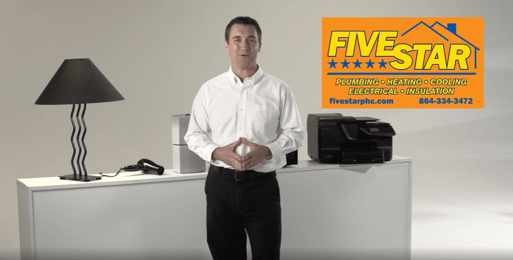 a man with electrical appliances at his back