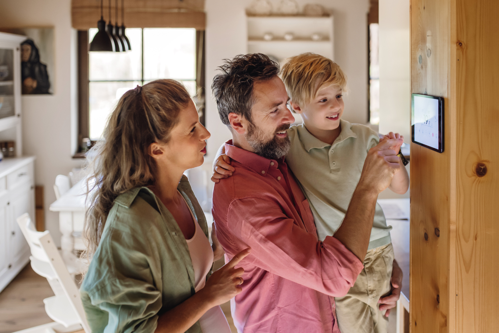 family adjusting thermostat together