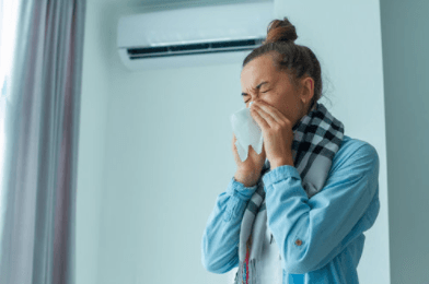 woman blowing her nose in tissue