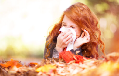 woman blowing her nose